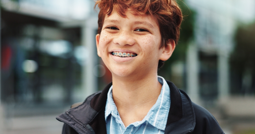 child smiling with braces